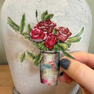 Pretty pink and red roses sticker in a boho vase. 