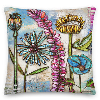 A throw pillow with colorful boho wildflowers and stars. Artwork by Jennifer Lambein. 