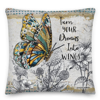 A throw pillow with a blue and gold butterfly in a wildflowers garden. It says turn your dreams into wings. Artwork by Jennifer Lambein. 