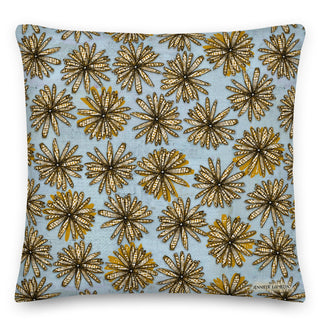 A throw pillow with a golden checkered flower pattern on a soft and rustic blue background. Artwork by Jennifer Lambein. 