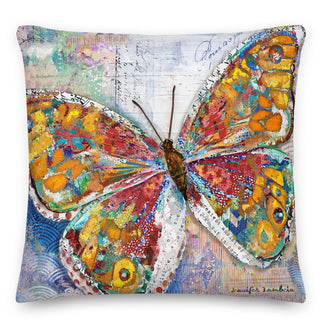 A throw pillow with a bright boho butterfly on it. Artwork by Jennifer Lambein. 