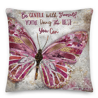 A boho throw pillow with a pink butterfly that says, :Be gentle with yourself, you're doing the best you can." Artwork by Jennifer Lambein. 