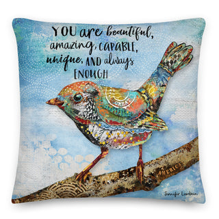 A throw pillow with a whimsical bird on a blue sky background that says, "You are beautiful, amazing, capable, unique, and always enough." rtwork by Jennifer Lambein. 