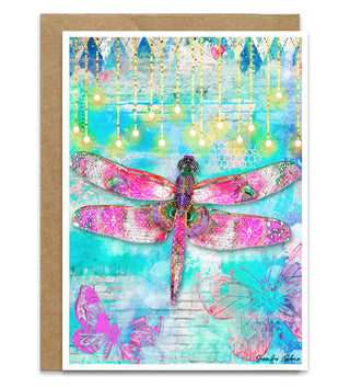 A greeting card with a bright pink dragonfly and bright pink butterflies on a blue sky background with string lights. Artwork by Jennifer Lambein. 