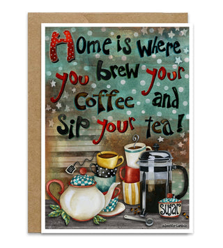 A greeting card with a kraft envelope, featuring a whimsical illustration of a tea pot, french press, coffee and tea cups, and a sugar bowl. The text says, 'Home is Where you brew your Coffee and sip your tea!'. Artwork by Jennifer Lambein. 