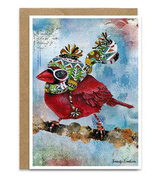 A Christmas winter holiday card with a whimsical watercolor cardinal wearing a fun colorful knit winter hat on a blue sky background. Artwork by Jennifer Lambein. 