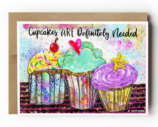 Card with colorful cupcakes and text 'Cupcakes ARE Definitely Needed' on a white background