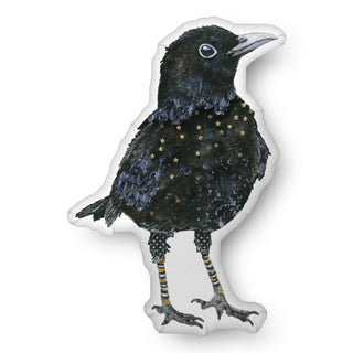 A custom shaped throw pillow shaped like a watercolor blackbird with gold stars. Artwork by Jennifer Lambein. 
