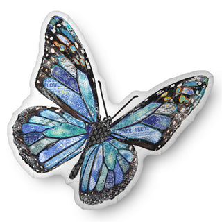 A custom shaped throw pillow shaped like a boho blue butterfly. Artwork by Jennifer Lambein. 