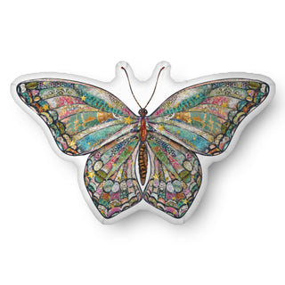 A throw pillow in the shape of a bright boho butterfly with stars. Artwork by Jennifer Lambein. 