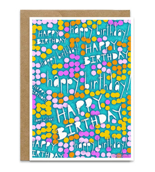 A birthday greeting card with a kraft paper envelope, featuring a colorful pattern of white 'HAPPY BIRTHDAY' text and multicolored dots on a turquoise background. Artwork by Jennifer Lambein. 