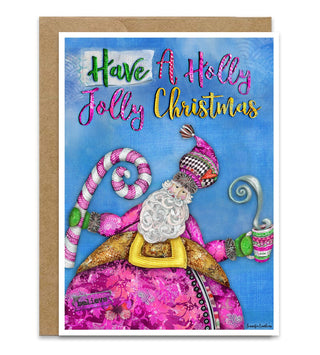 A festive Christmas greeting card featuring a whimsical Santa Claus wearing pink illustration with candy canes and the text 'Have A Holly Jolly Christmas' on a blue background, shown with a brown kraft envelope behind it.