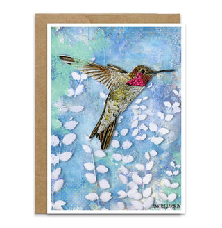 Greeting card with a hummingbird illustration on a blue skies with plants background. Artwork by Jennifer Lambein. 
