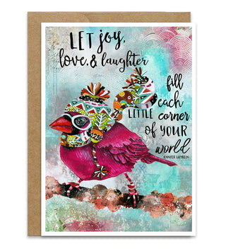 A greeting card with a kraft envelope, featuring a colorful watercolor-style bird wearing a patterned knit hat and scarf, with the quote, 'LET joy, love & laughter fill each little corner of YOUR world' by Jennifer Lambein. 