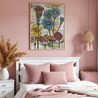 Bedroom with pink walls, floral artwork, and pink bedding.
