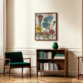 Green armchair and wooden bookshelf with books in a room with floral artwork on the wall.
