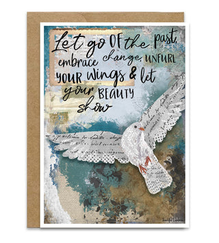 A greeting card with a kraft envelope behind it. The card features a vintage-style collage with a white dove, teal and beige textures, cursive text, and the quote, 'Let go of the past, embrace change, unfurl your wings & let your beauty show. Artwork by Jennifer Lambein. 