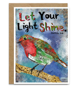 A Christmas card with a whimsical red and green bird on it that says, Let your light shine. 
