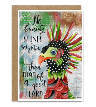A whimsical Christmas card with a red and green bird that says, "No beauty shines like the of a good heart." Artwork by Jennifer Lambein. 