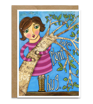 A greeting card with a folk art girl hugging a tree with coffee bark with the words around her "Love" "Plant" "Hug". She's wearing a pink striped dress. It has a blue sky background. It comes with a Kraft envelope. Artwork by Jennifer Lambein. 