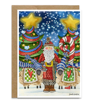 A Christmas greeting card with a brown kraft envelope, featuring a whimsical illustration of Santa Claus standing between decorated trees and sheep under a starry night sky. Artwork by jennifer Lambein. 