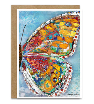 A greeting card with a boho multicolored butterfly wing on a blue sky background. Artwork by Jennifer Lambein. 