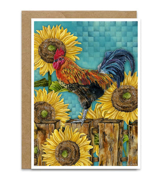 A greeting card with a kraft envelope, featuring a colorful illustration of a rooster standing on a wooden fence among bright yellow sunflowers against a turquoise checkered background. Artwork by Jennifer Lambein. 