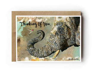 Greeting card with an elephant illustration and 'Thinking Of You' text on a white background