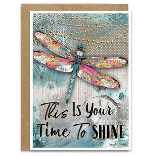 Greeting card with dragonfly illustration and motivational text that says this is your time to shine on a blue sky textured background. Artwork by Jennifer Lambein. 