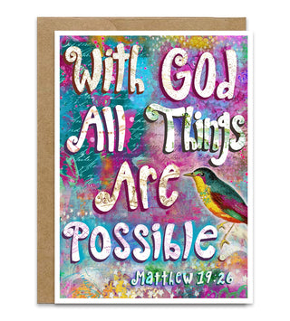 A square greeting card with a kraft paper envelope, featuring the inspirational quote 'With God All Things Are Possible' and 'Matthew 19:26' in stylized white lettering over a colorful, textured background with a small bird illustration.