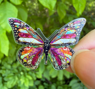 A mini boho butterfly vinyl waterproof glossy sticker. Artwork by Jennifer Lambein. 